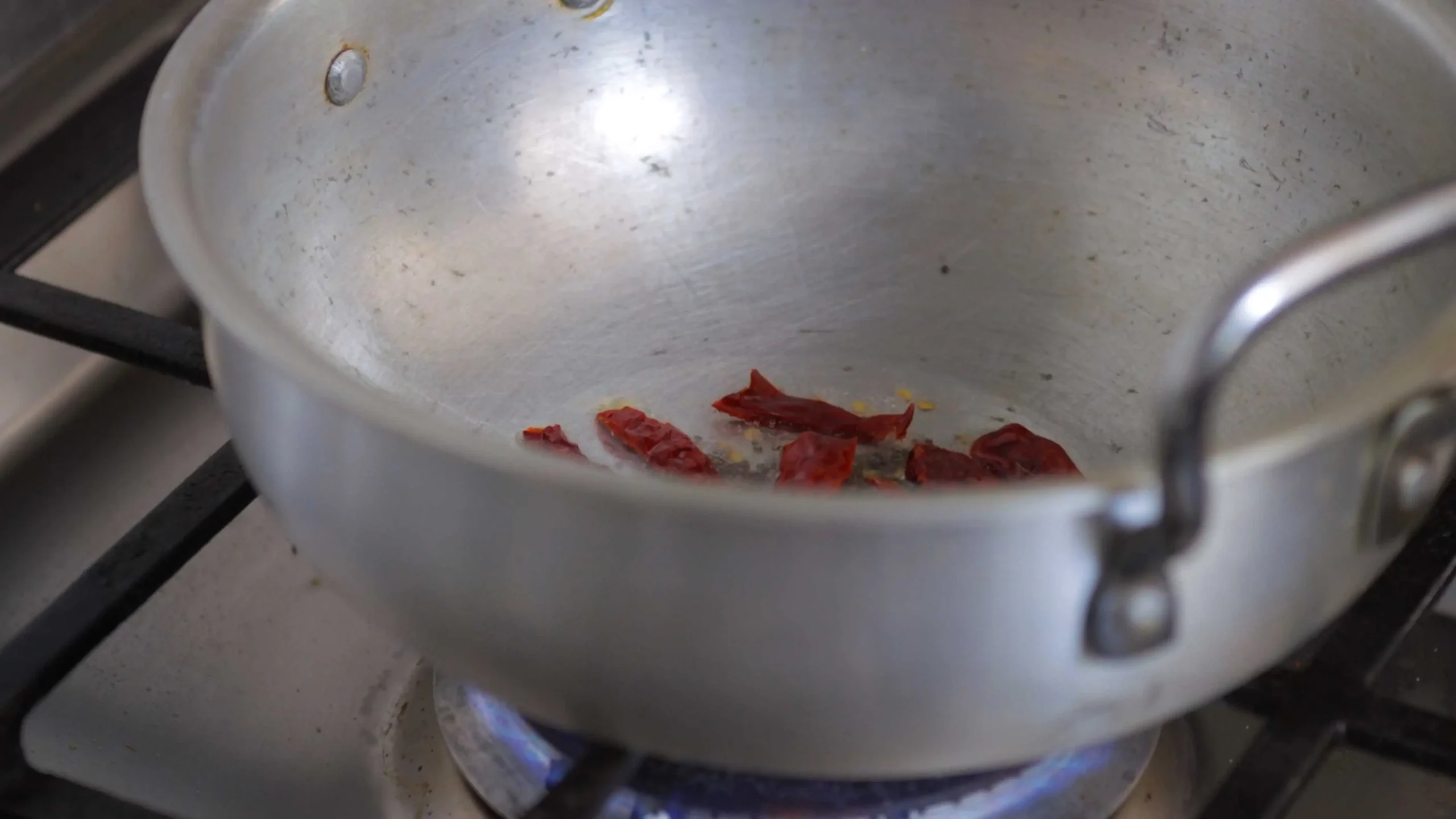 dry red chillies tempering for making beans chana dal stir fry