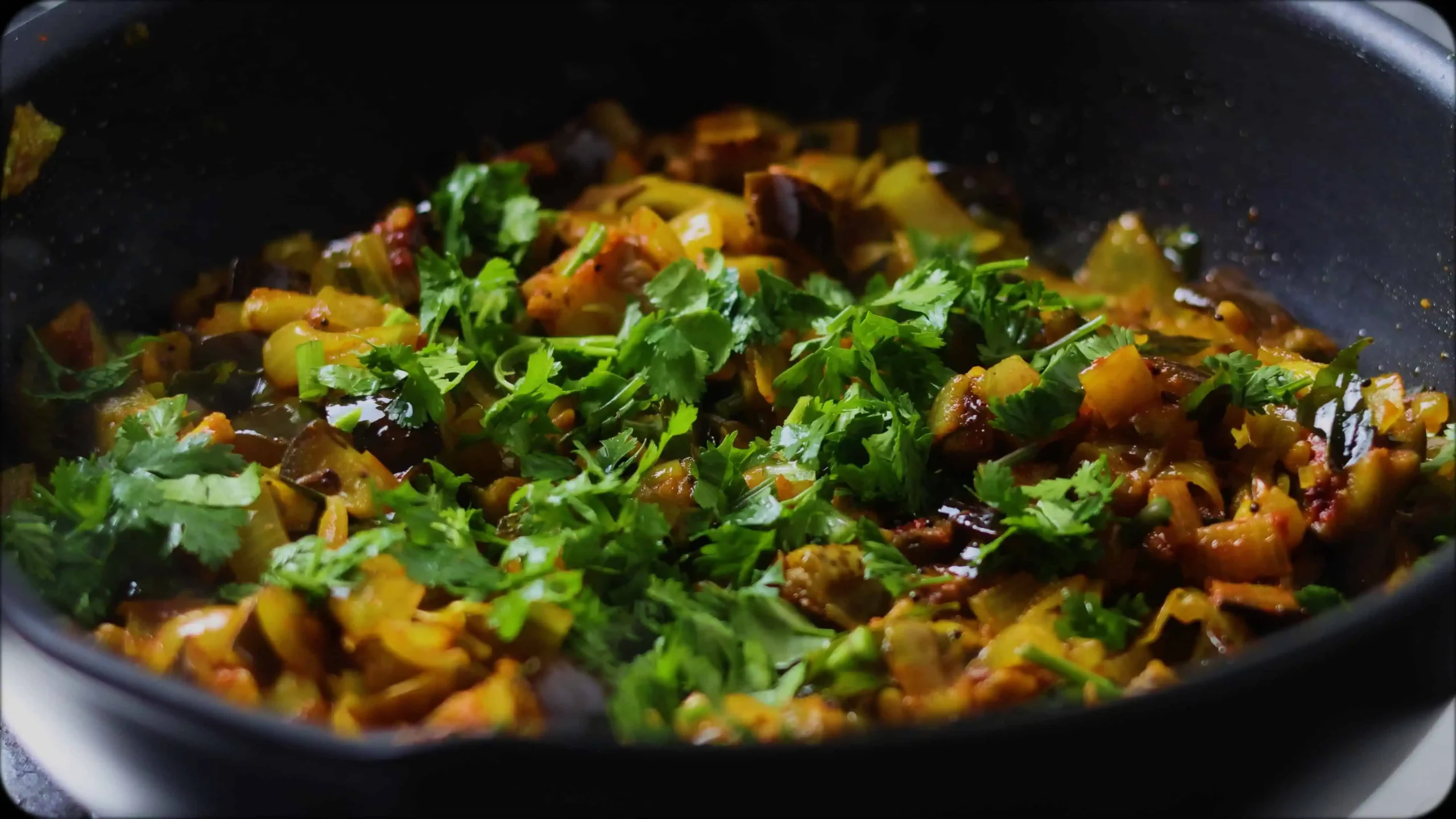 brinjal stir fry garnished with coriander leaves