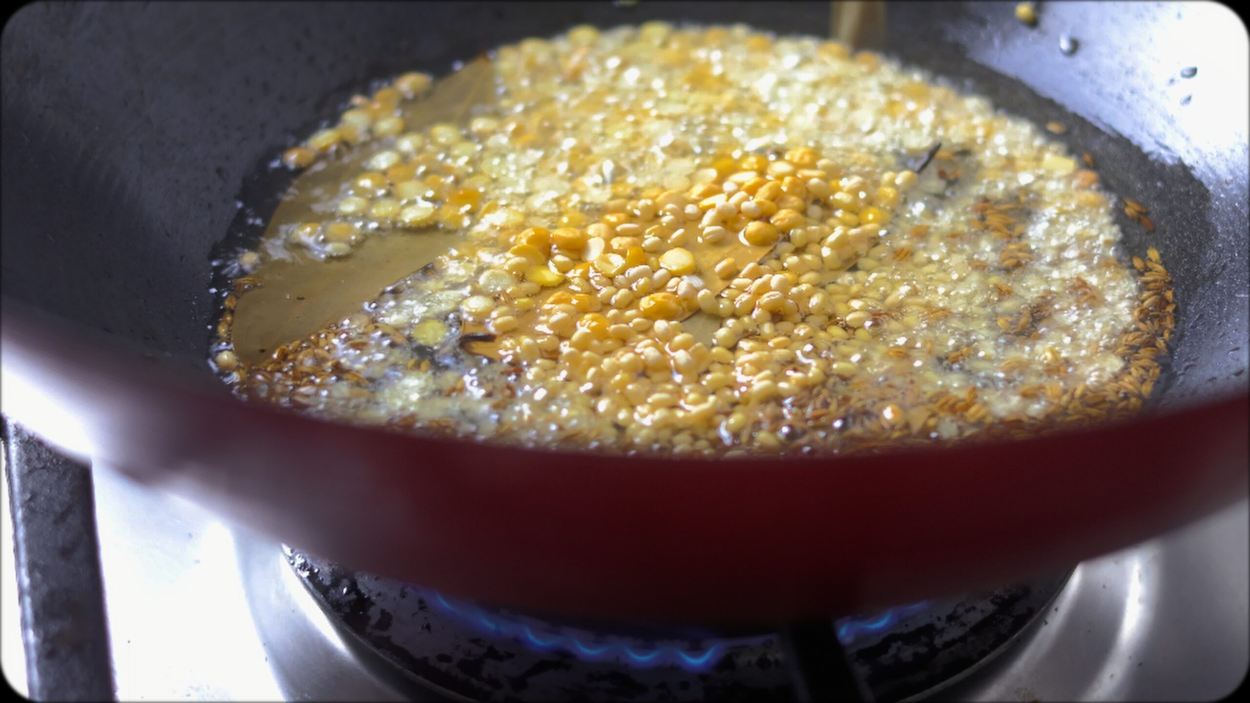 making Coriander rice in a wok. chana dal