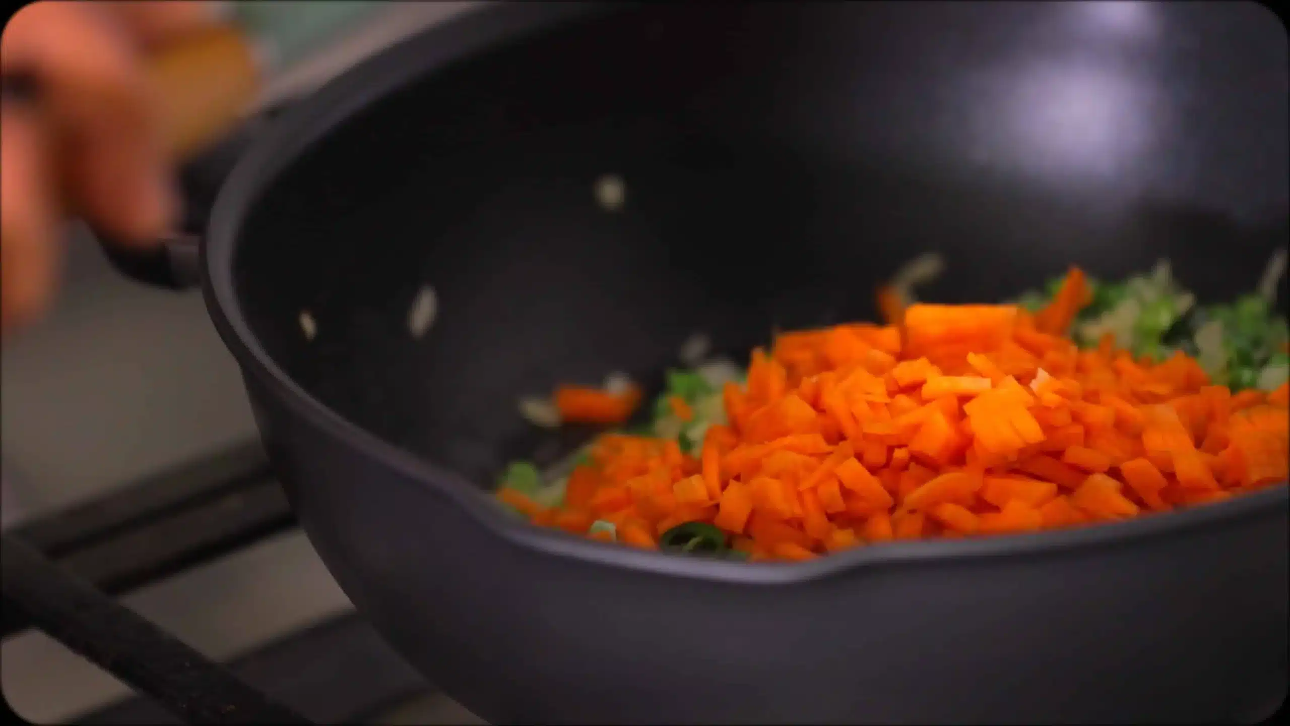 sauteeing onions, beans and carrots for making CousCous Fried Rice