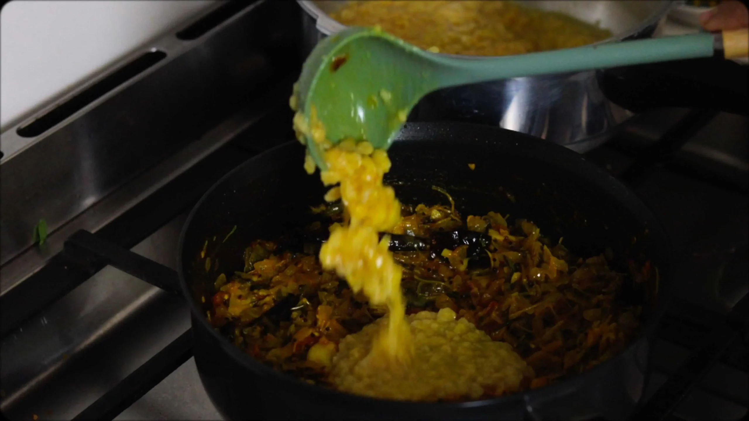 sauteeing with mustard, cumin seeds and red chillies, diced tomatoes for making methi dal