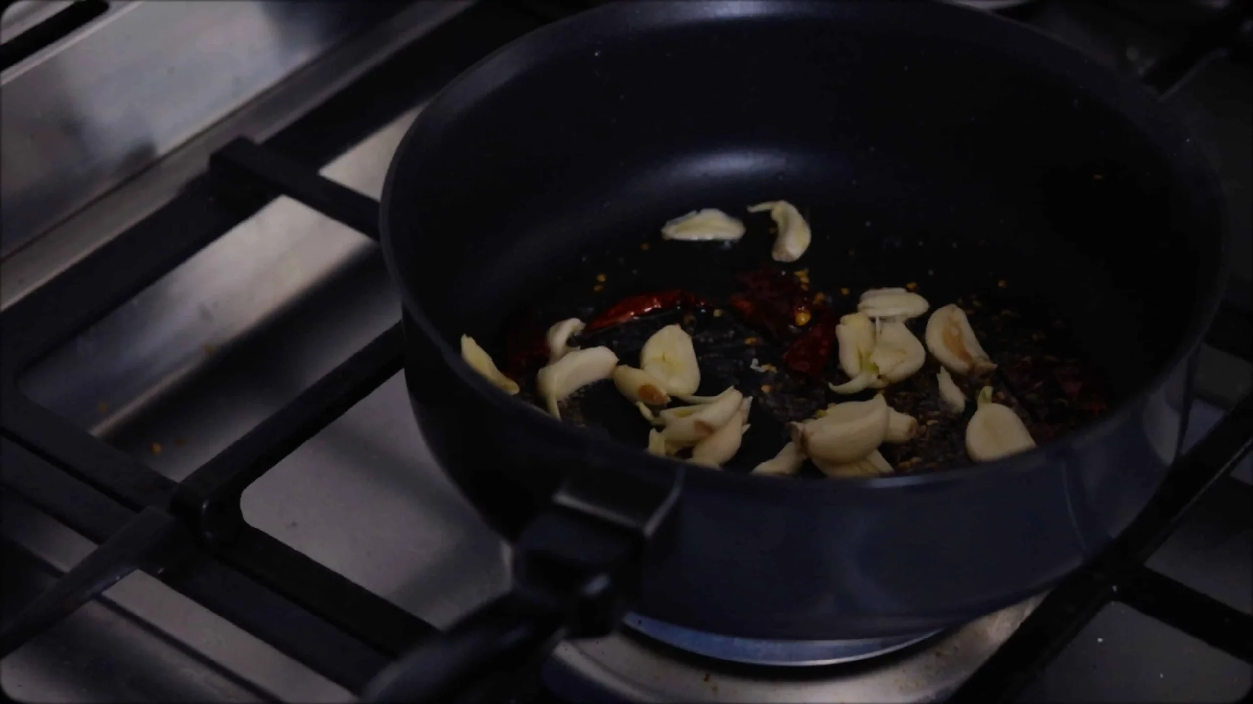 sauteeing with mustard, cumin seeds, chillies, crushed garlic etc for making methi dal