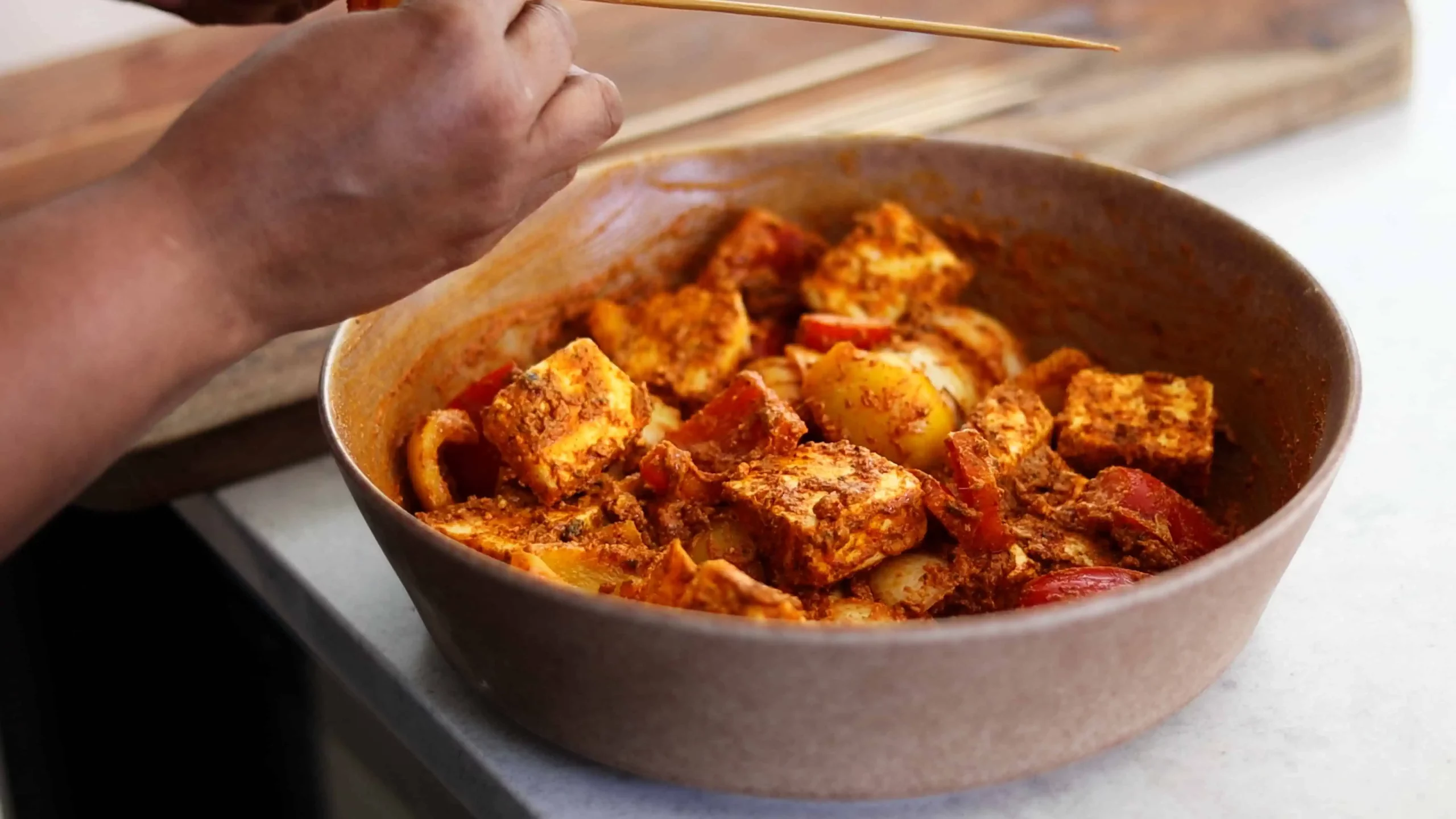 marinade made of hung curd, turmeric, ginger garlic for paneer tikka skewers