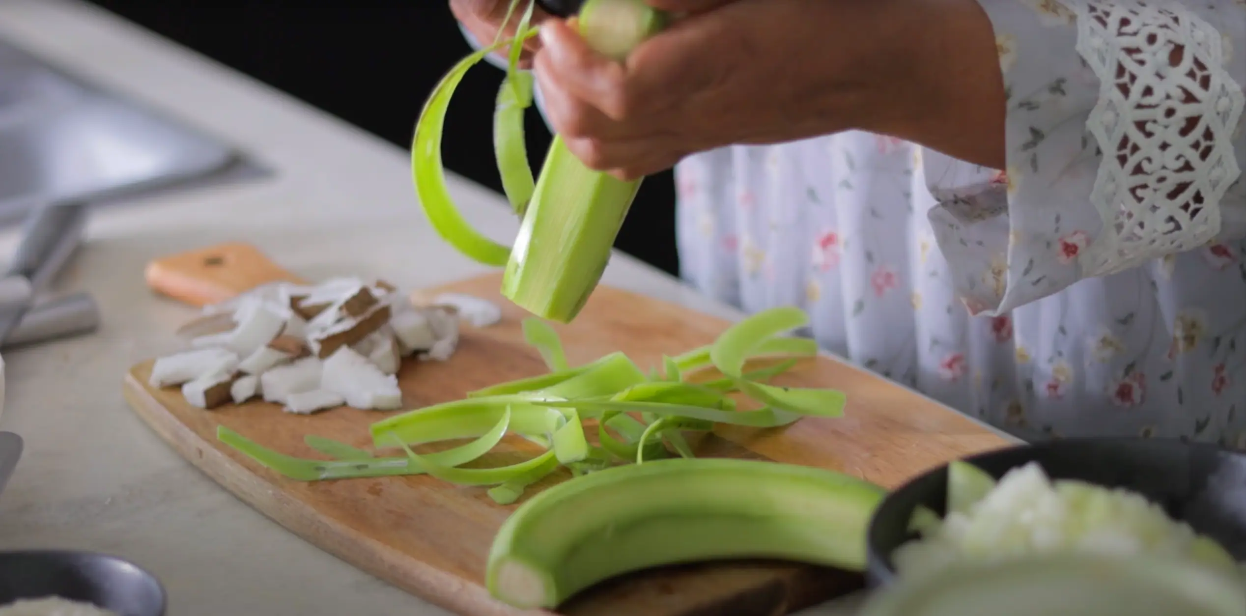 peeling the raw banana or plantain