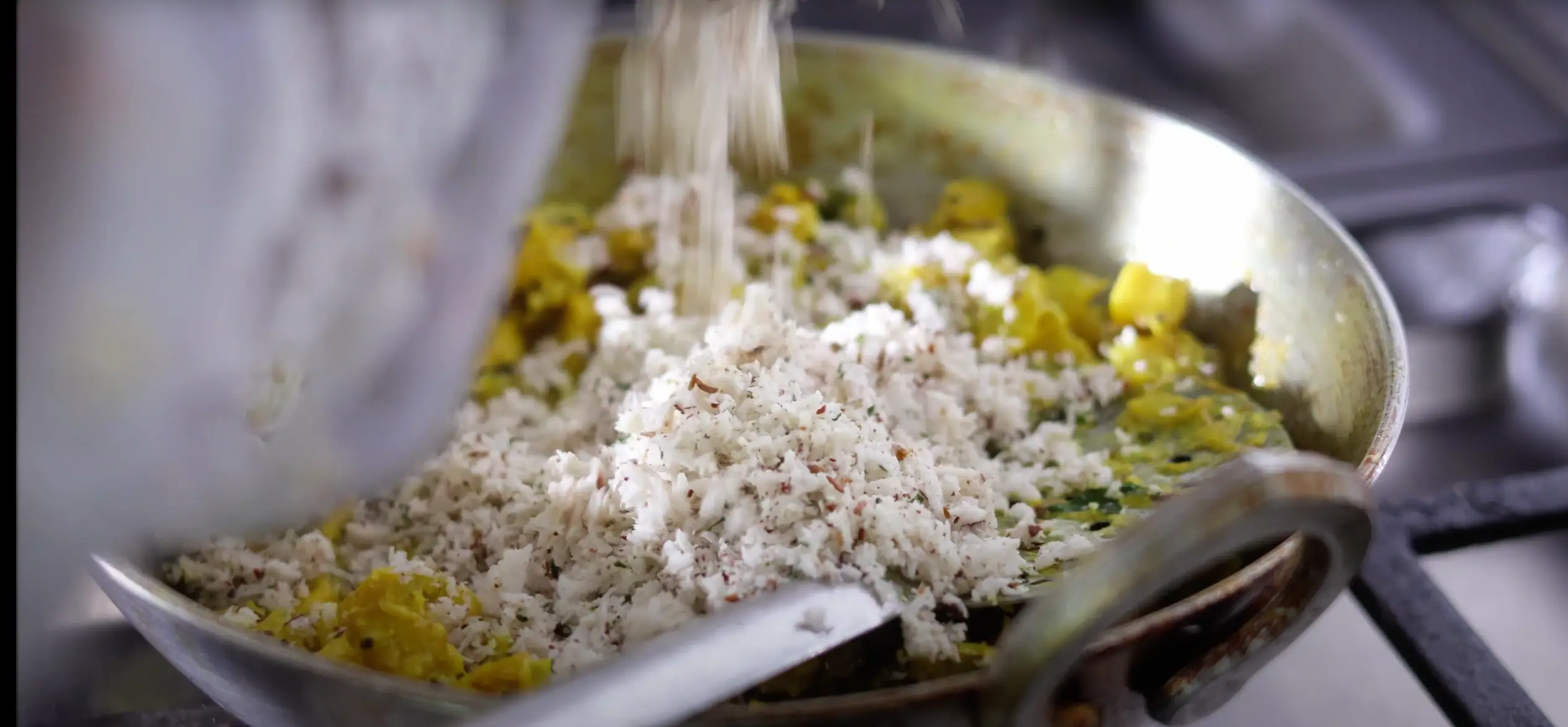 adding the coconut masala for aratikaya kura