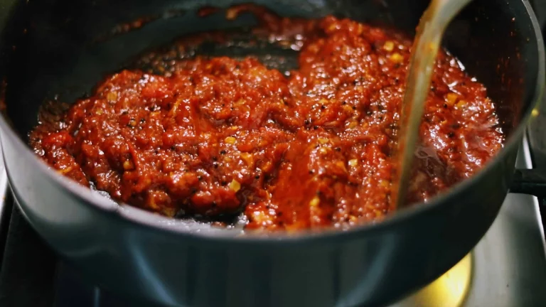 Tomato pachadi made from tinned or canned tomatoes in a saucepan